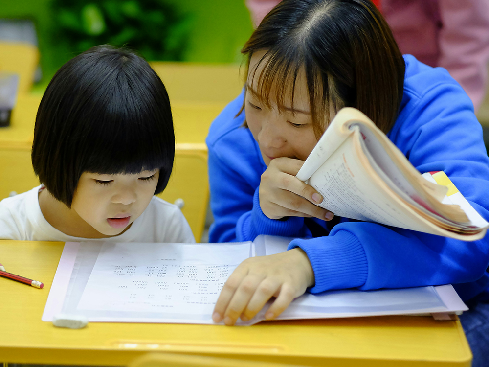 Mom helping daughter