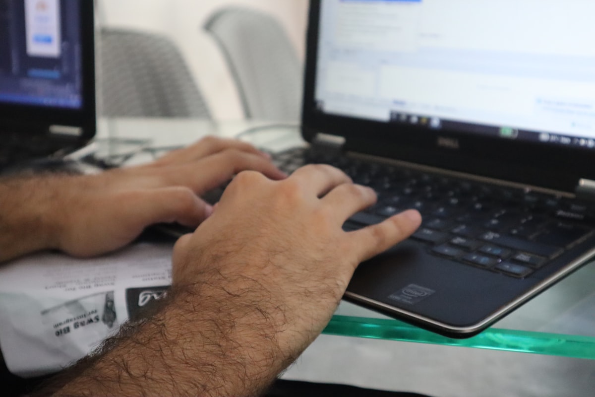 Man typing on laptop