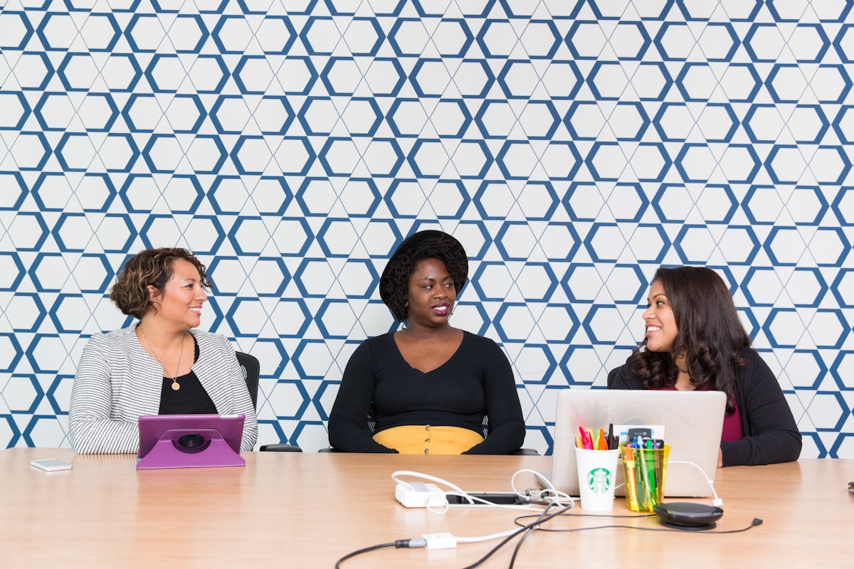 Three women collaborating at table