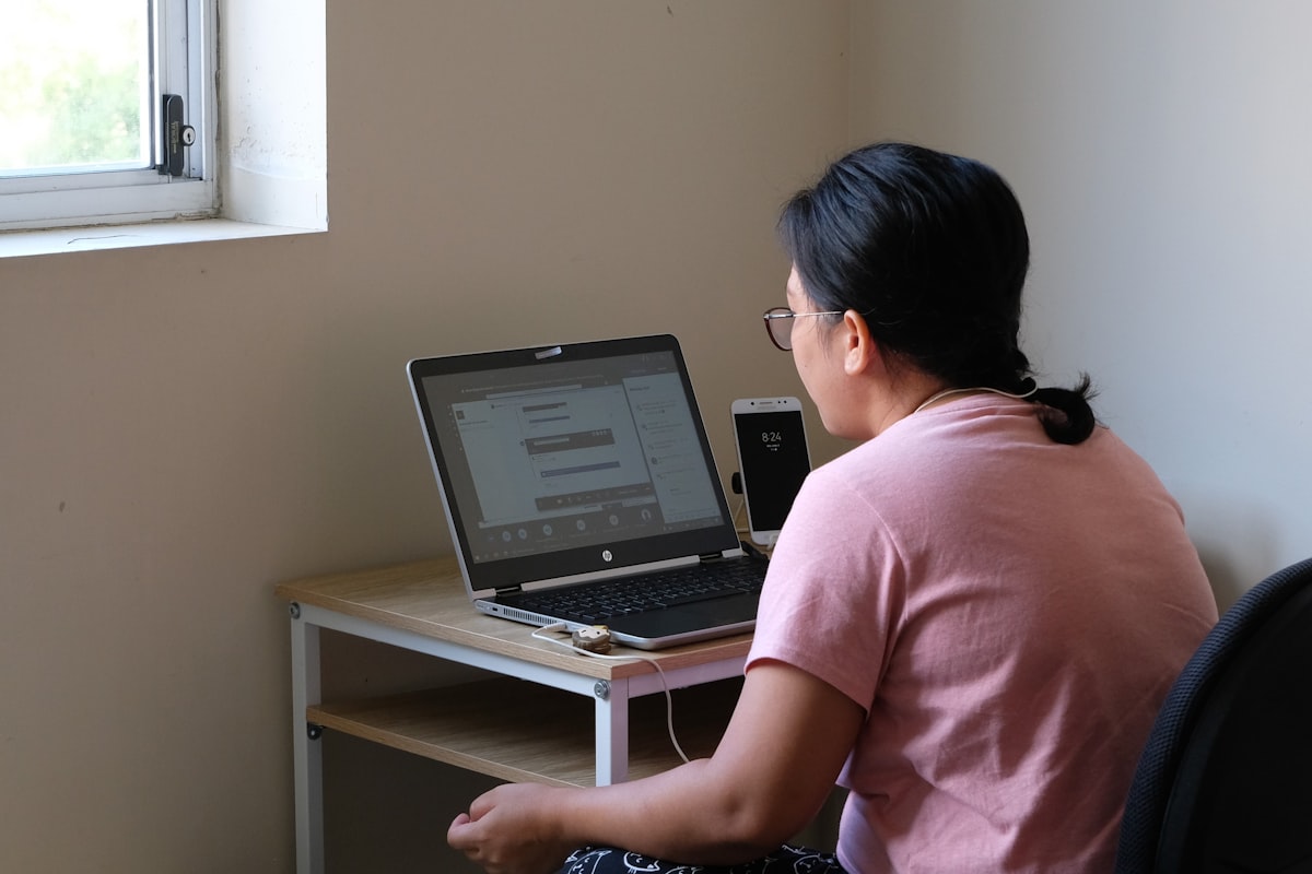 Woman studying on laptop for certification